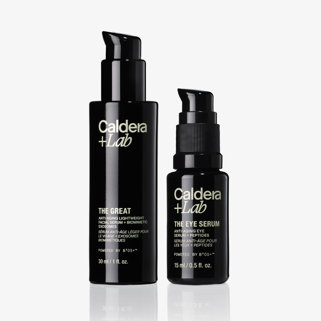 Two black bottles of Caldera Lab skincare products on a white background