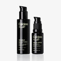 Two black bottles of Caldera Lab skincare products on a white background