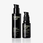 Two black bottles of Caldera Lab skincare products on a white background
