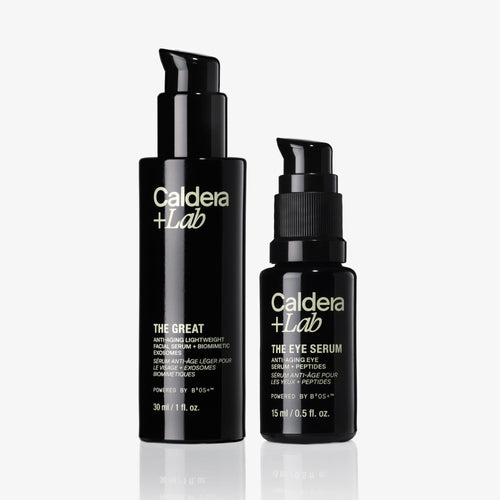 Two black bottles of Caldera Lab skincare products on a white background