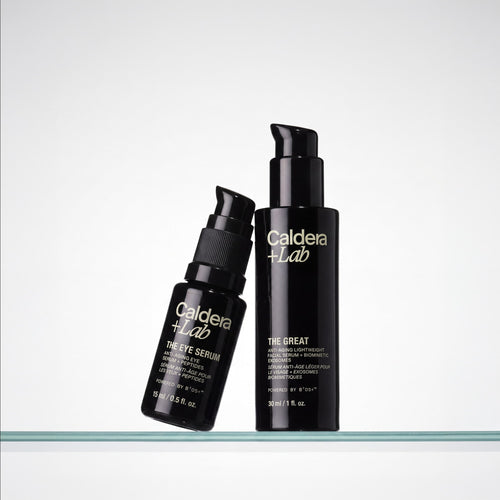 Two black bottles of Caldera Lab skincare products on a white background
