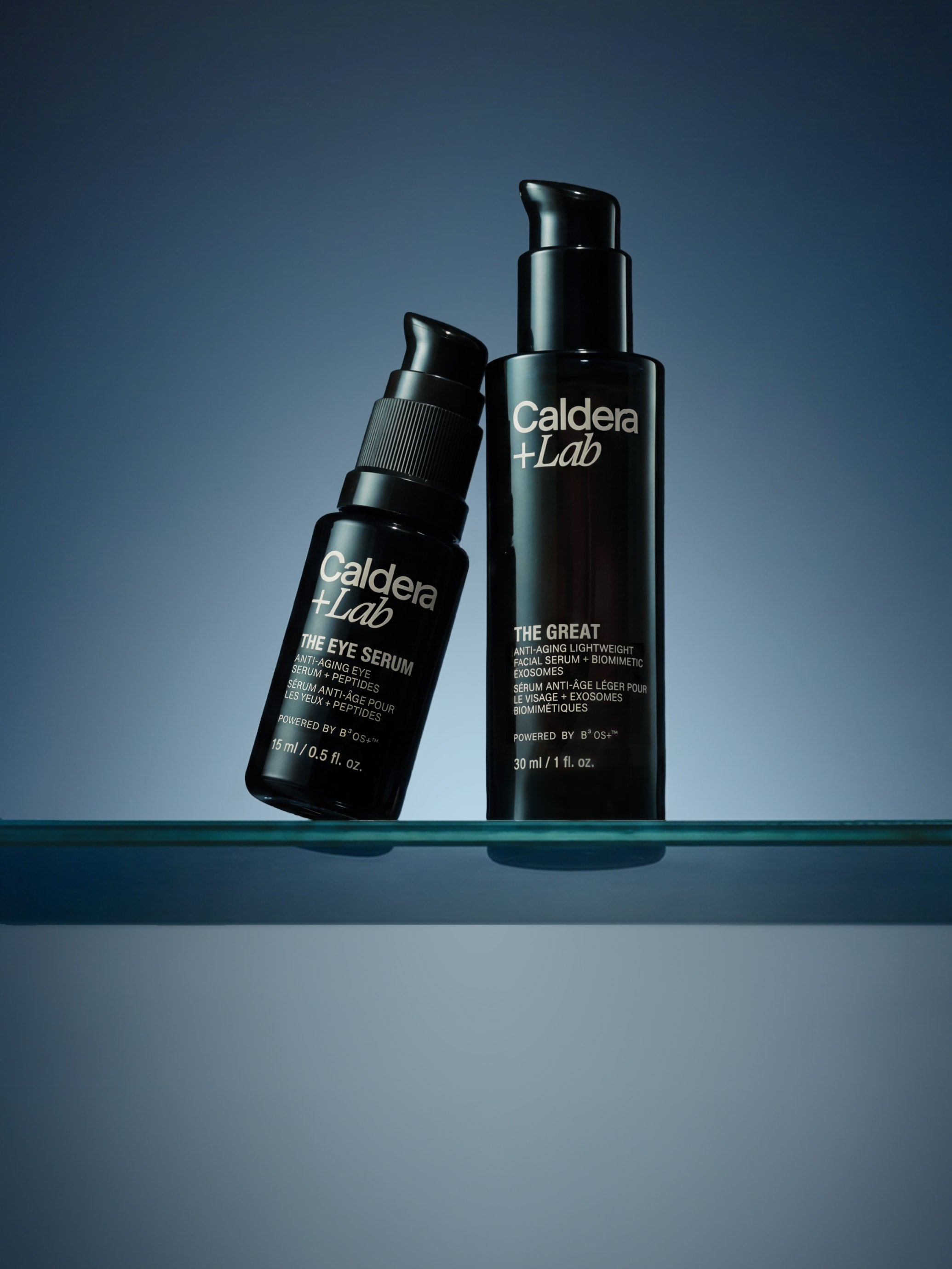 Two bottles of Caldera Lab skincare products on a gradient blue background