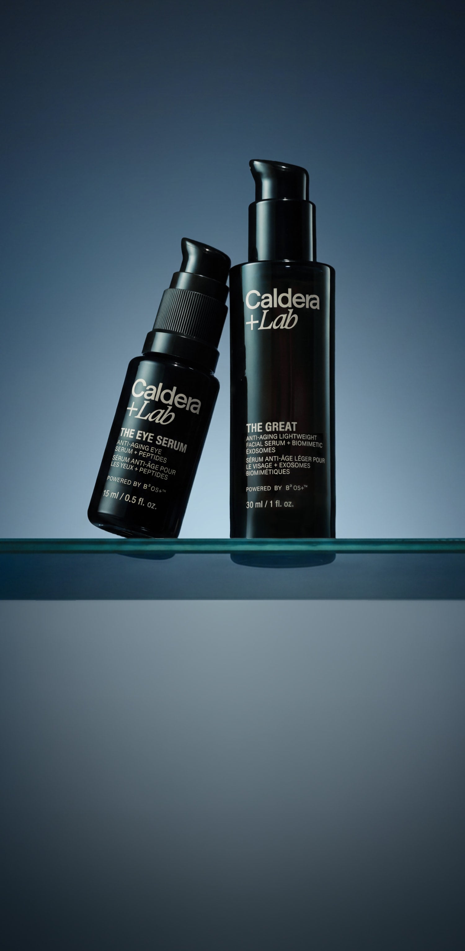 Two black bottles of Caldea Lab on a reflective surface with a gradient blue background