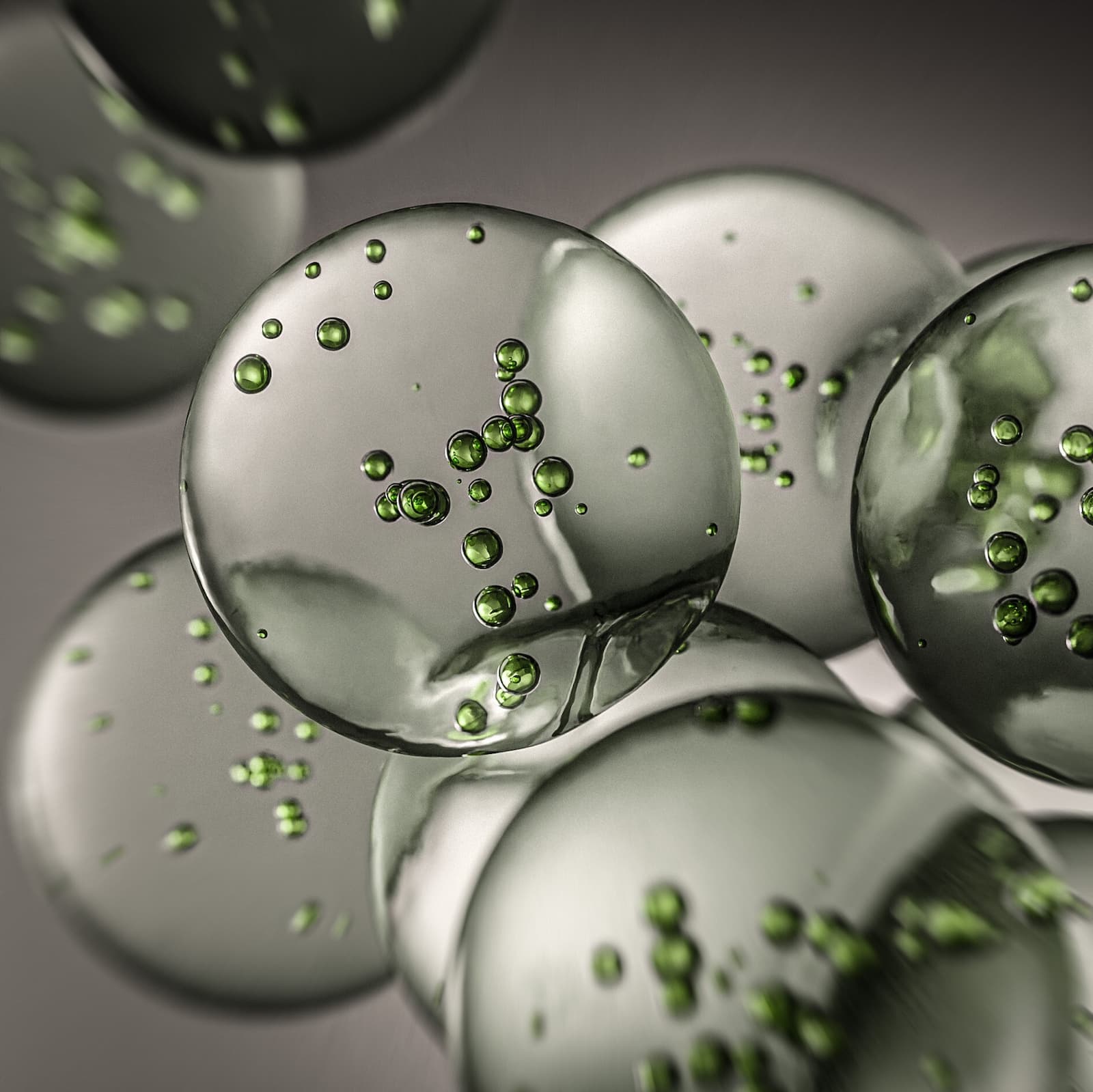 A collection of exosomes on a gray background