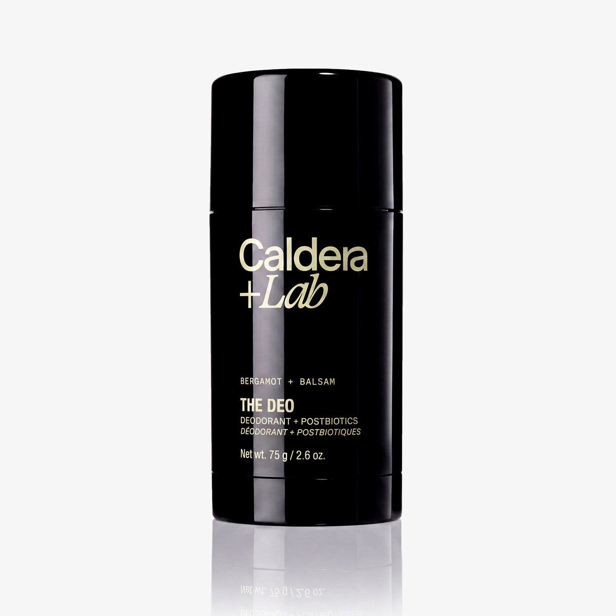 A black deodorant with tan lettering that reads 'Caldera + Lab' and 'THE DEO' on a clean white background with a soft reflection below