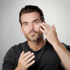Man applying The Base Layer moisturizer